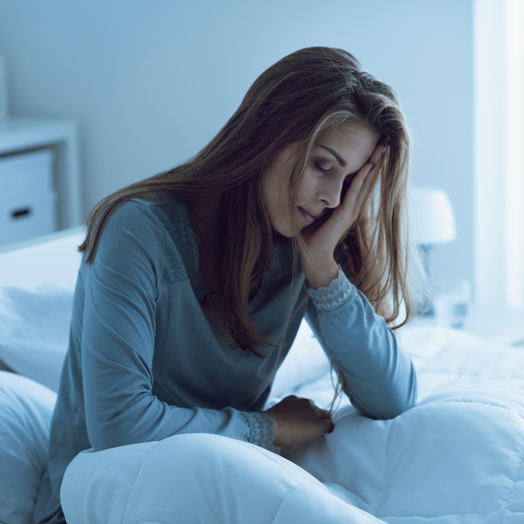 Woman stressed out with hand on head