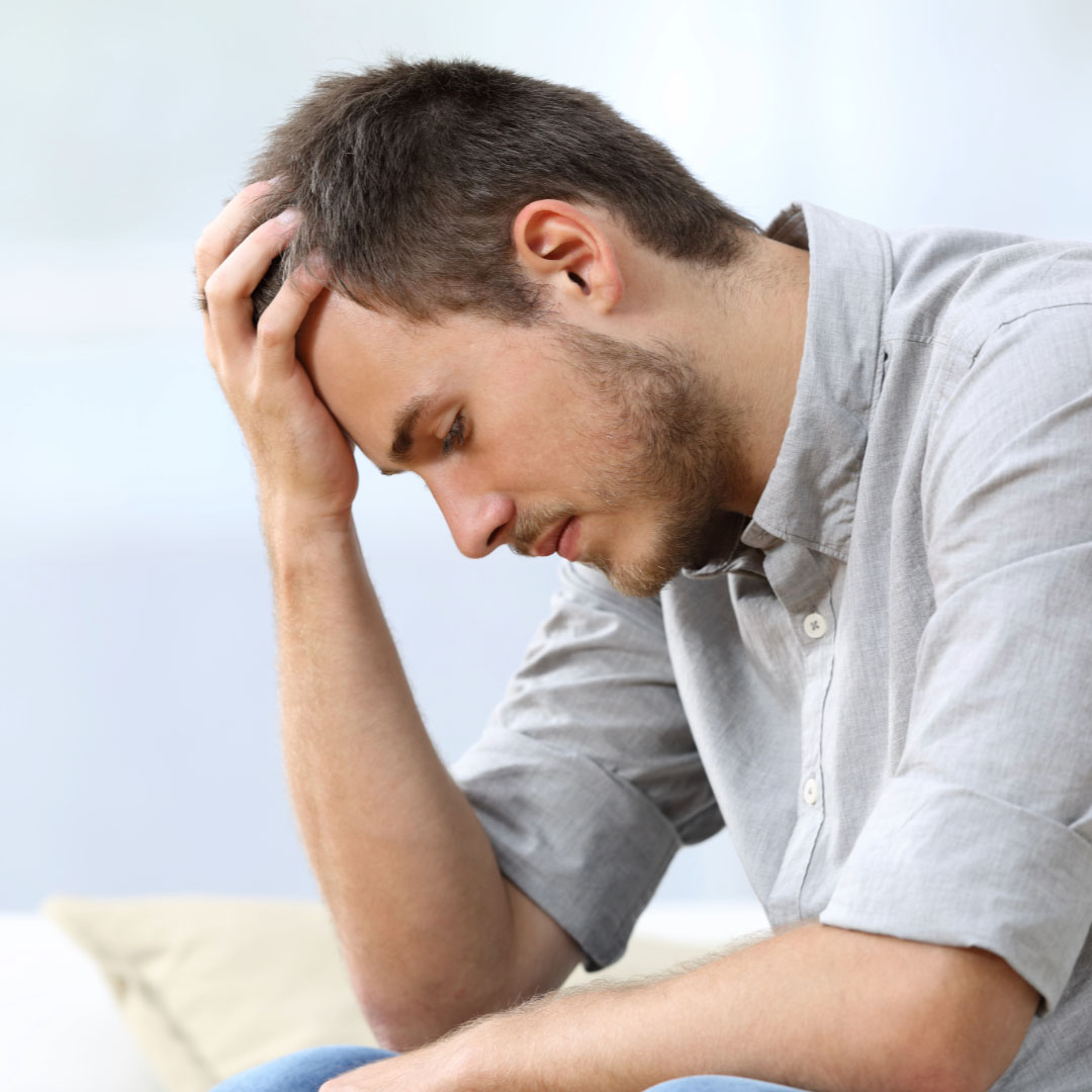 Depressed man looking down
